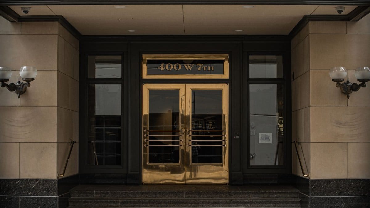 Entrance of MorningStar Oil and Gas at 400 W 7th, depicting a classic and formal architectural style.