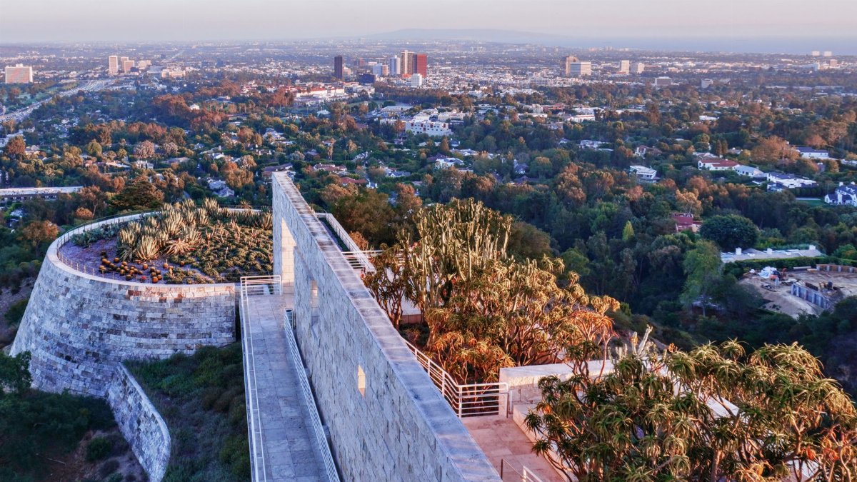Stunning panoramic view from Getty Center featuring modern architecture and lush gardens against Los Angeles skyline.