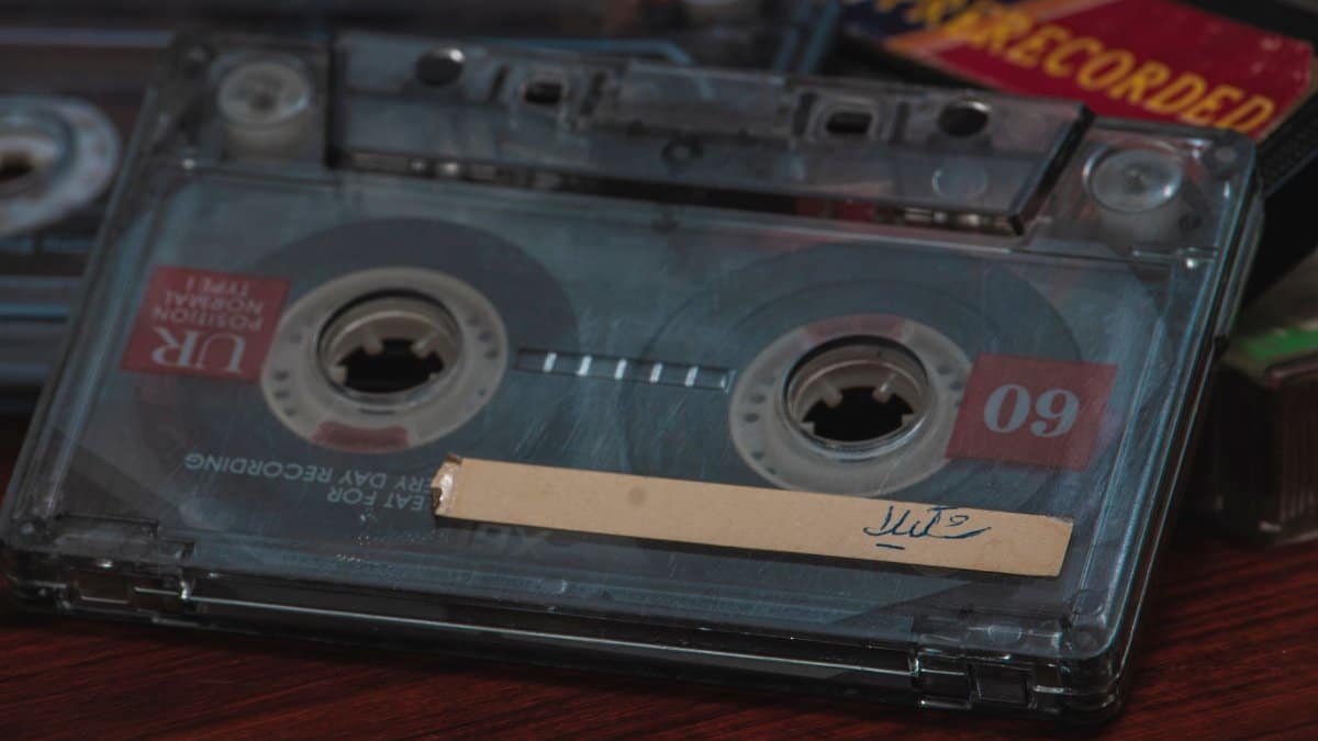 Close-up of a classic audio cassette, showcasing analog nostalgia.