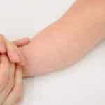 Tender infant foot massage providing soothing comfort and care.
