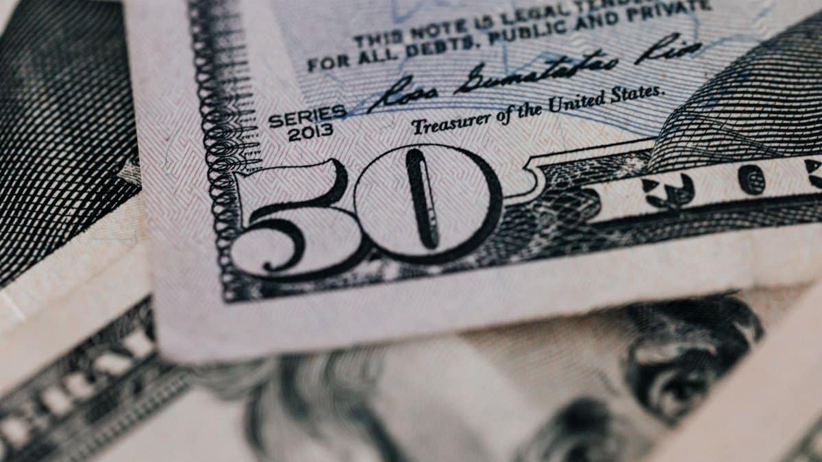 From above closeup of American dollar banknote with signature and printed words above paper money