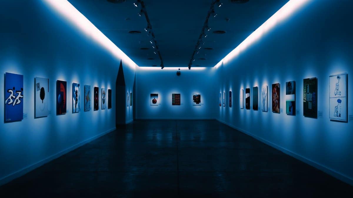 Contemporary artworks displayed in a dimly lit modern gallery space in Buenos Aires.
