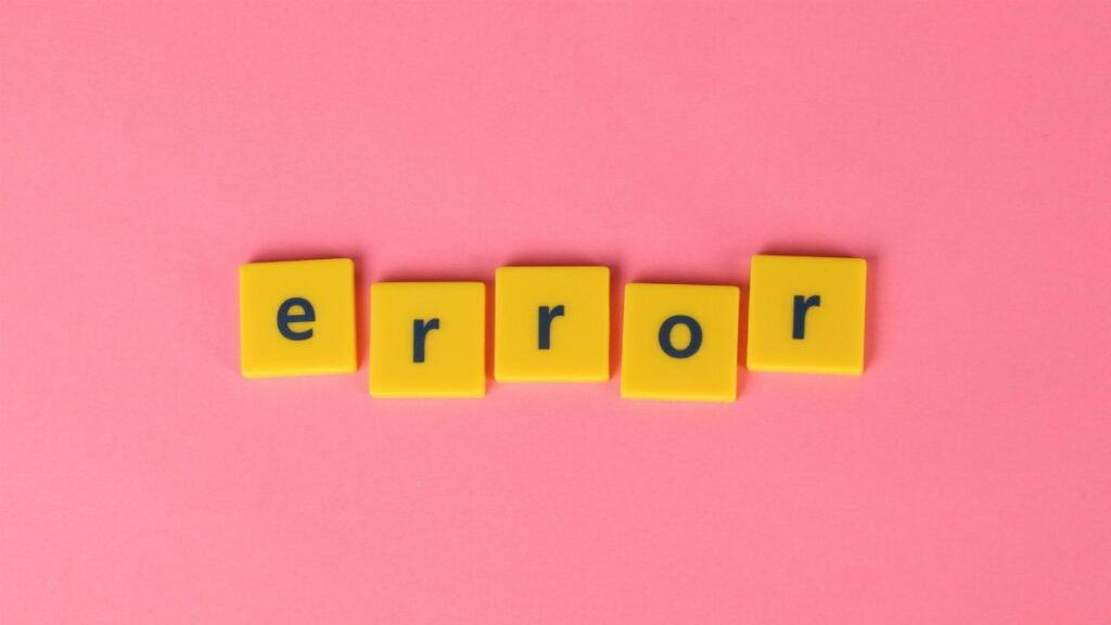 Yellow block letters spelling 'error' on a vibrant pink background, capturing a playful message.
