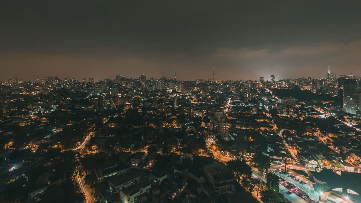 Stunning aerial nighttime view of São Paulo's vibrant skyline and city lights.