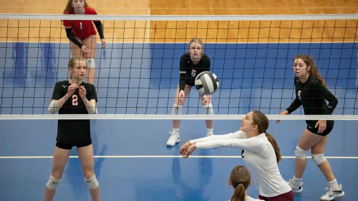 Exciting moment captured during a women's volleyball match in Rochester, MN.