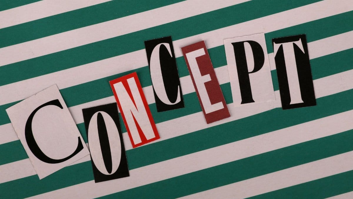 Word 'CONCEPT' in cut-out letters on striped green and white background. Creative design layout.