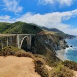 Stunning view of Bixby Creek Bridge against coastal cliffs and ocean in Big Sur, California.