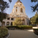 Elegant view of Pasadena City Hall with lush gardens on a sunny day.