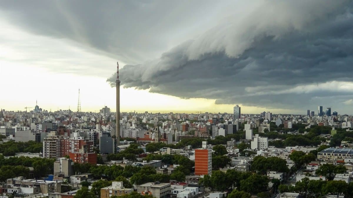 A striking storm cloud formation looming over Montevideo's urban landscape, creating a dramatic and intense atmosphere.