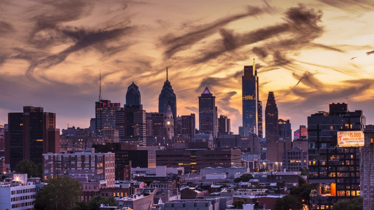 Stunning view of Philadelphia skyline at twilight with dramatic cloud formations enhancing the cityscape.