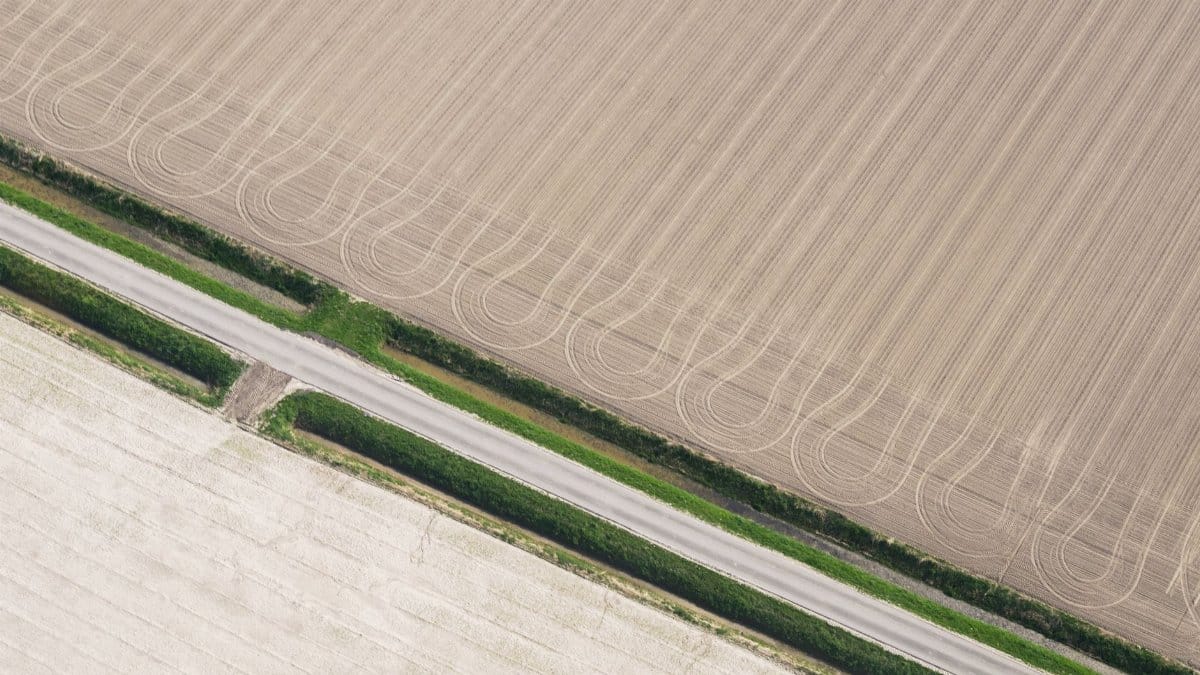 Aerial image showcasing intricate patterns on cropland fields in Soest, Netherlands.