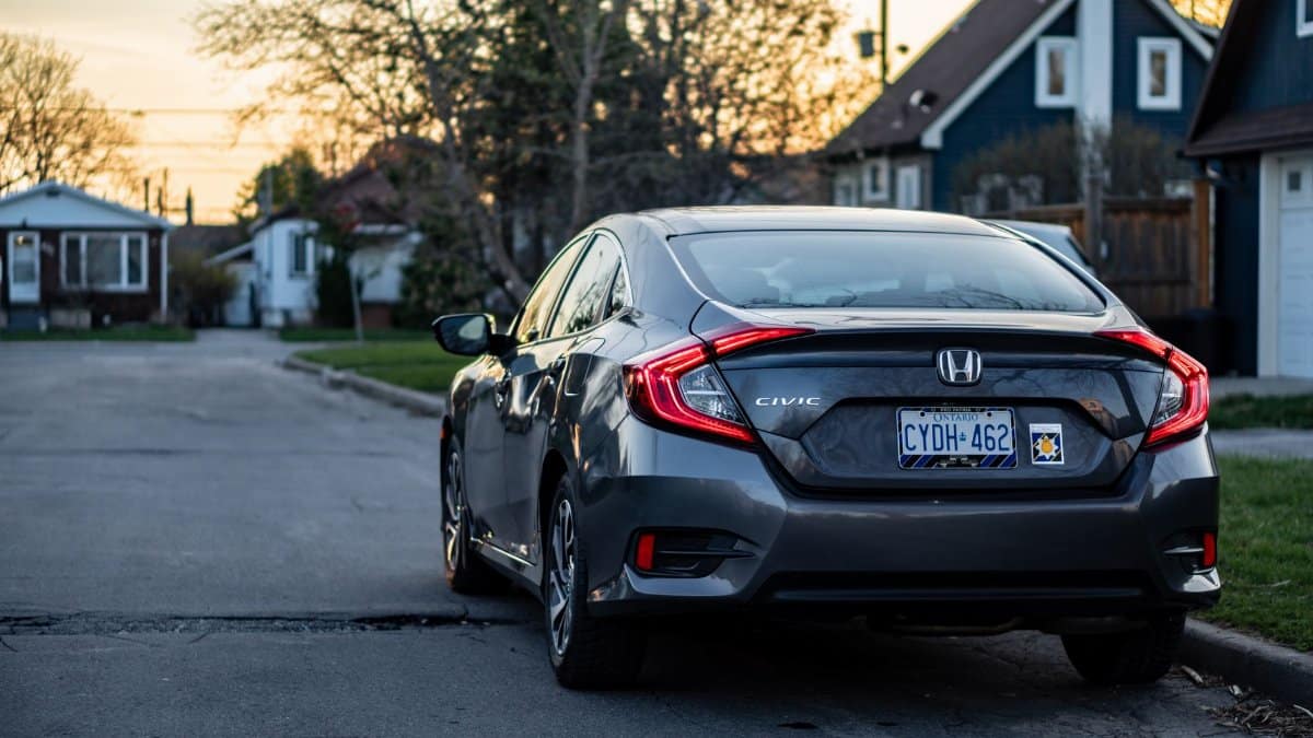 Contemporary Honda Civic on a quiet residential street in Toronto at sunset.