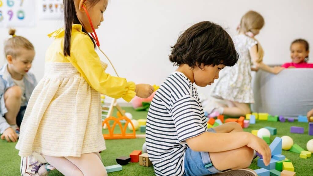 Joyful children engaged in playtime at a cheerful kindergarten setting.