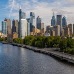 Stunning view of Philadelphia skyline with the Schuylkill River in the foreground, taken on a sunny day.