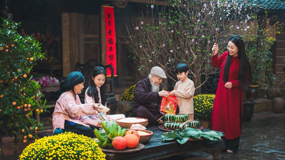 Family engaging in traditional Tet New Year celebrations in Hanoi, showcasing cultural traditions.