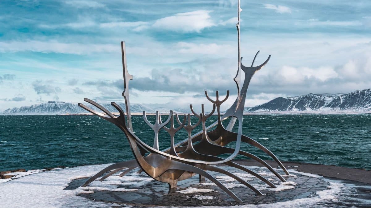 The iconic Sun Voyager sculpture on Reykjavik's snowy shore during winter.