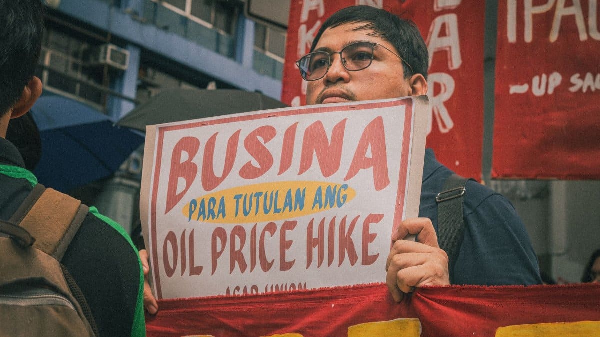 Protester holds a sign against oil price hikes during a rally in Metro Manila, Philippines.