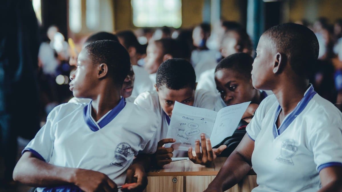 African students in a classroom collaborate on a learning assignment.