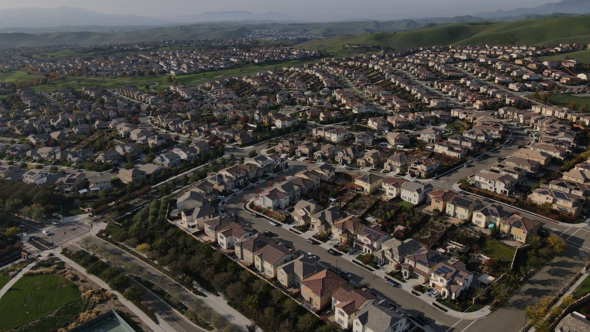 Wide aerial shot of Dublin, CA suburbs showcasing a sprawling residential landscape.