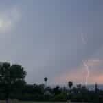 A striking lightning bolt captured during a storm at dusk in Redlands, California.