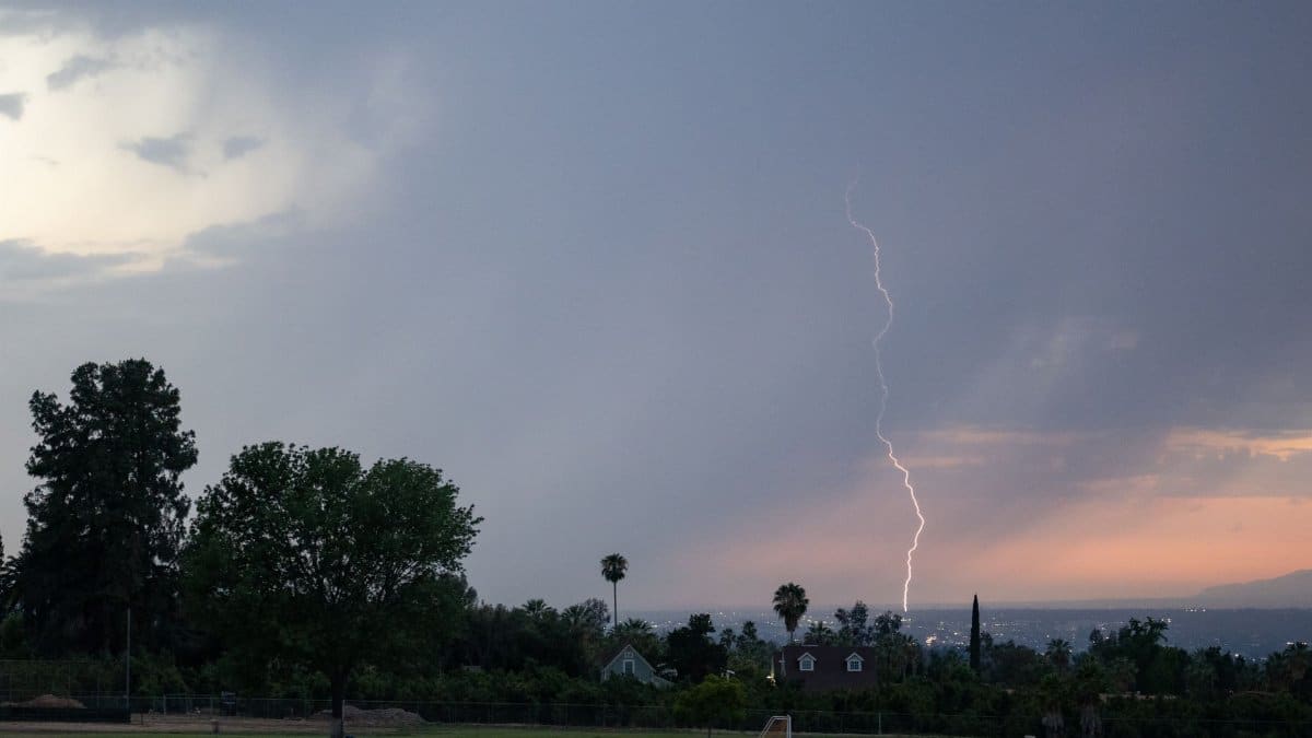 A striking lightning bolt captured during a storm at dusk in Redlands, California.