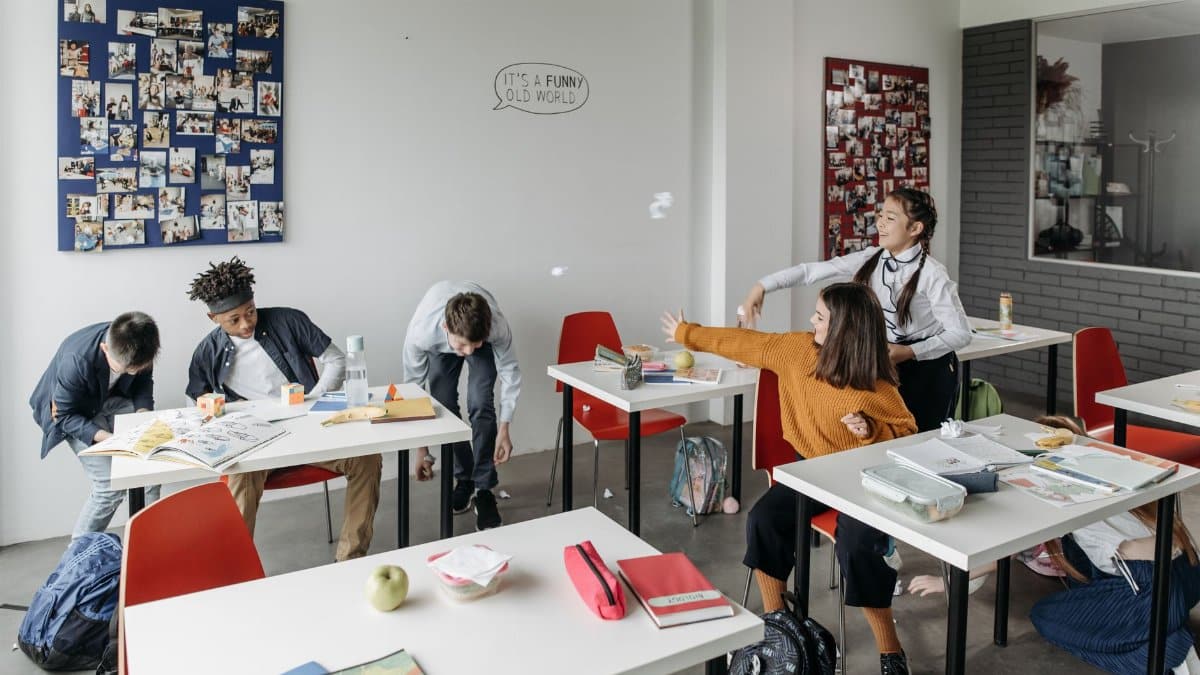Students enjoying break time in a lively classroom setting.
