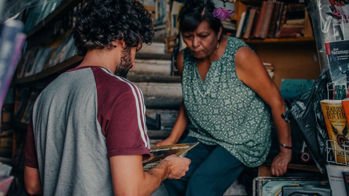 A man and woman explore vintage records in a Guanajuato bookstore.