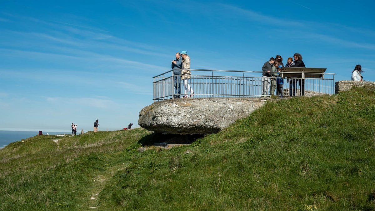 Visitors enjoy the stunning view from Cap Blanc-Nez in Escalles, France, on a clear spring day.
