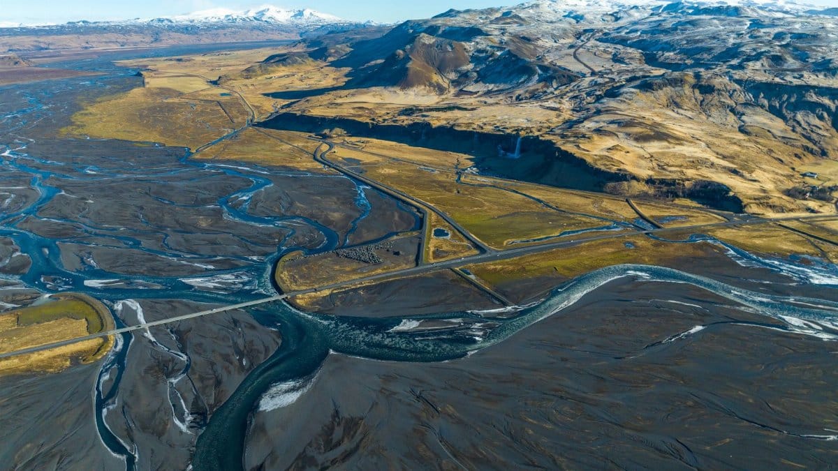 Stunning aerial photo showcasing the meandering rivers and volcanic landscapes of Vik, Iceland.
