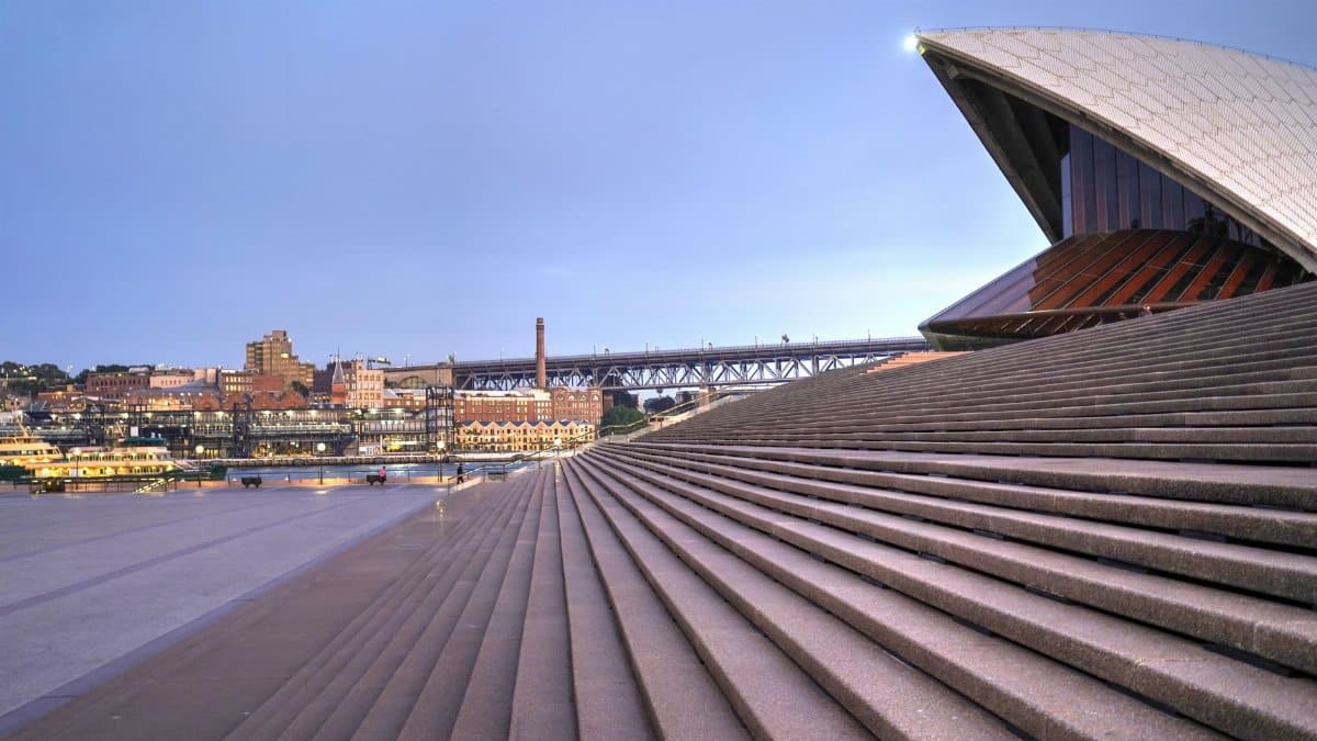 View of the Sydney Opera House with steps leading towards the Harbor Bridge in Sydney, Australia.