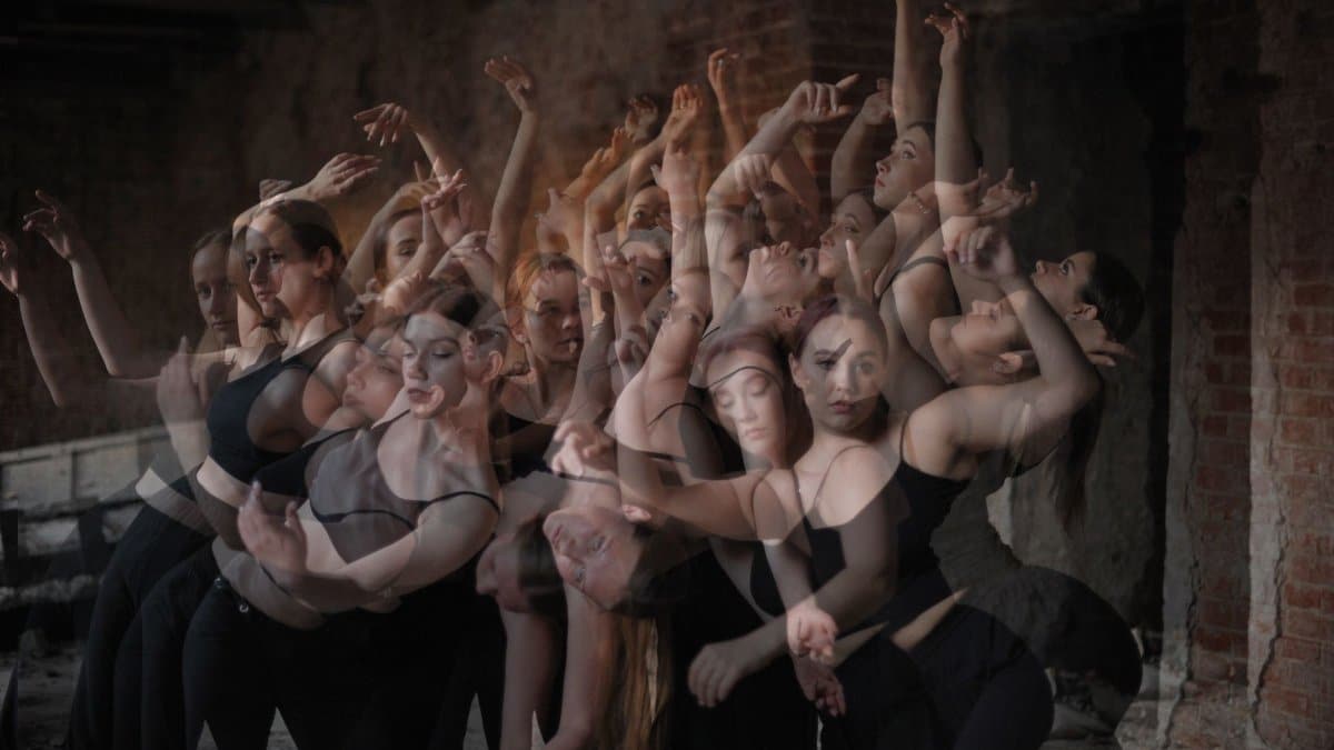 Captivating time-lapse capturing dancers' dynamic movements in an industrial setting.