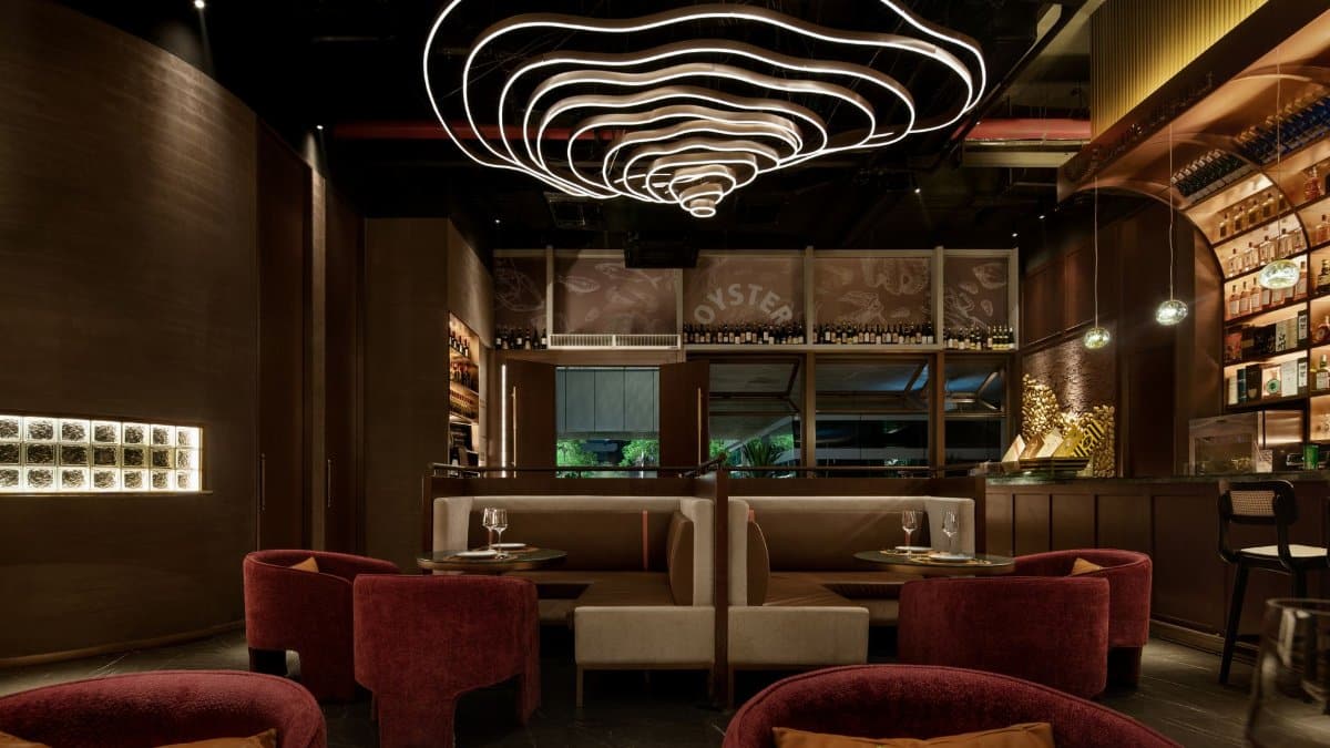 Sophisticated restaurant interior featuring contemporary design and unique lighting fixtures, perfect for fine dining.
