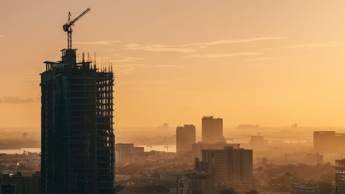 A breathtaking aerial view of Cebu City's skyline during the golden hour, showcasing urban development and high-rise buildings.