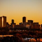 Dramatic sunset view of Fort Worth, Texas skyline. Warm tones highlight the city's architecture.