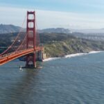 Aerial view of the Golden Gate Bridge spanning San Francisco Bay on a clear day.