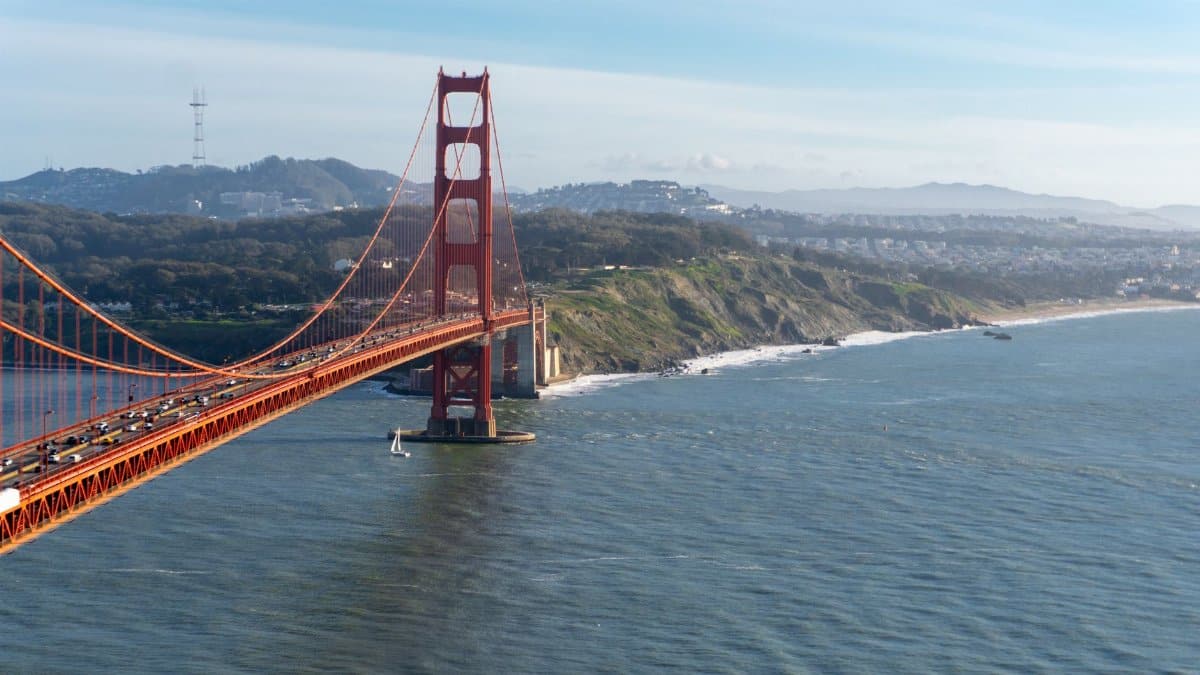 Aerial view of the Golden Gate Bridge spanning San Francisco Bay on a clear day.