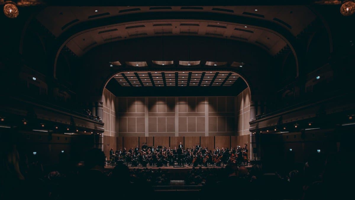Orchestra performing a symphony in a grand theater, showcasing exquisite classical music.