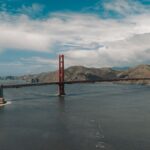 A breathtaking view of the Golden Gate Bridge spanning San Francisco Bay on a sunny day.