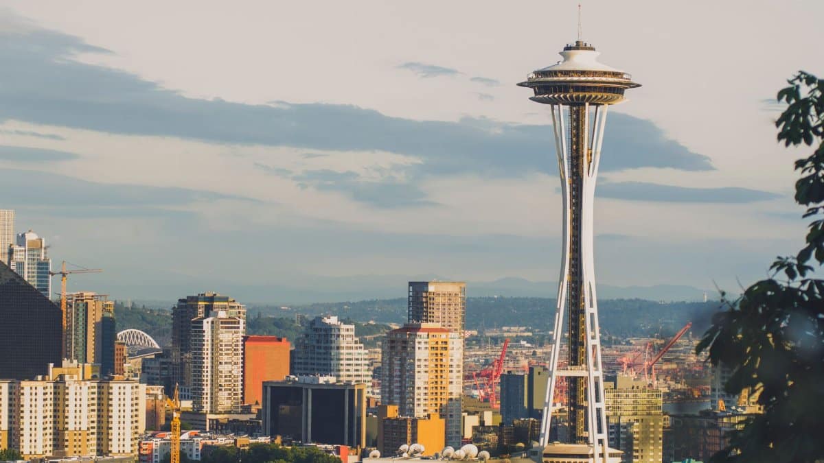 Vibrant skyline of Seattle featuring the iconic Space Needle under a clear sky.