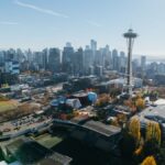 A stunning aerial photo capturing Seattle's skyline and iconic Space Needle on a clear day.