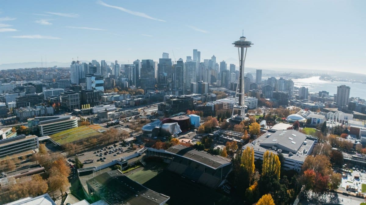 A stunning aerial photo capturing Seattle's skyline and iconic Space Needle on a clear day.