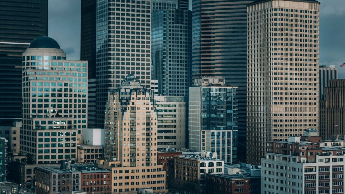 A view of Seattle's downtown skyscrapers under a cloudy sky, capturing urban architecture.
