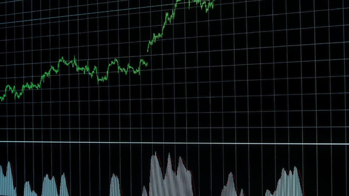 Rising stock market graph with grid lines, showing market data trends. Ideal for financial and economic concepts.