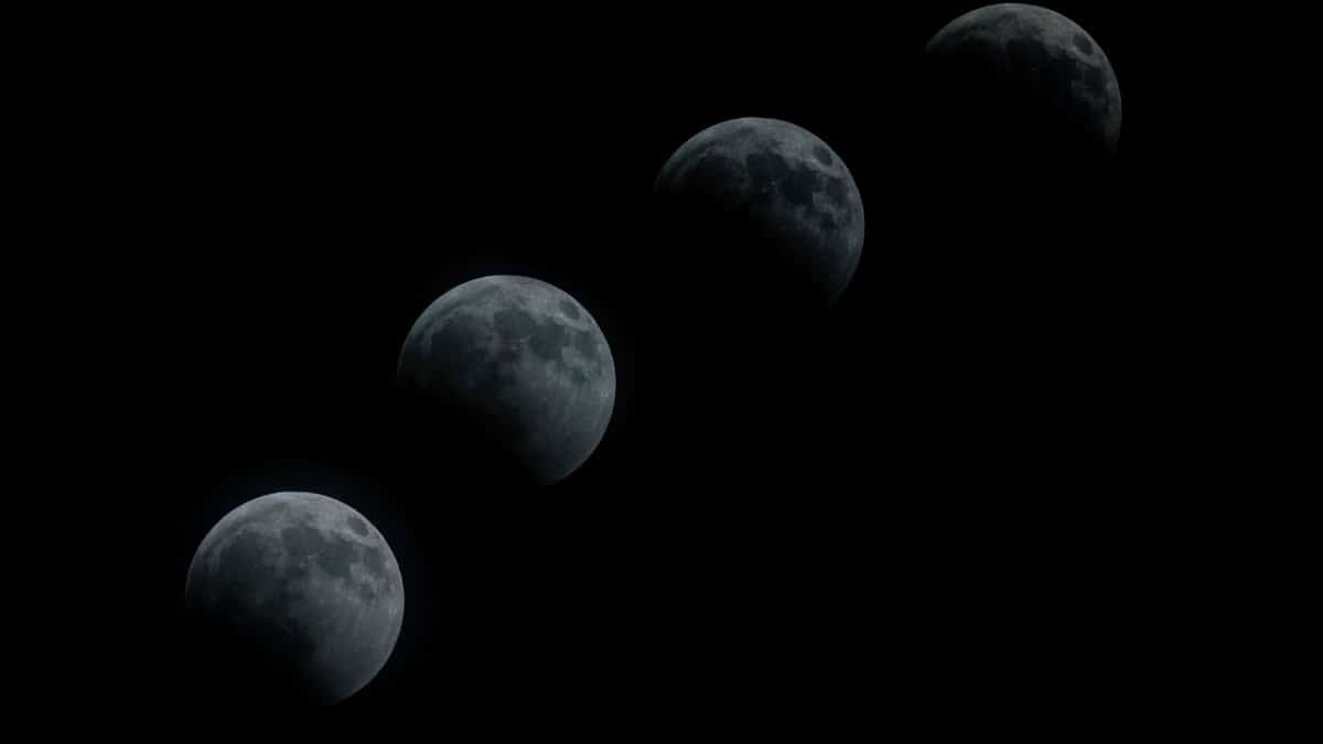 Sequence of lunar eclipse stages against a black sky, captured in Santiago.