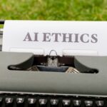 A vintage typewriter outdoors displaying "AI ethics" on paper, symbolizing tradition meets technology.