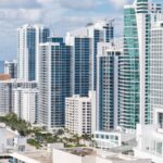 Aerial view of Hollywood, Florida's modern skyline along the coast with high-rise buildings and ocean views.