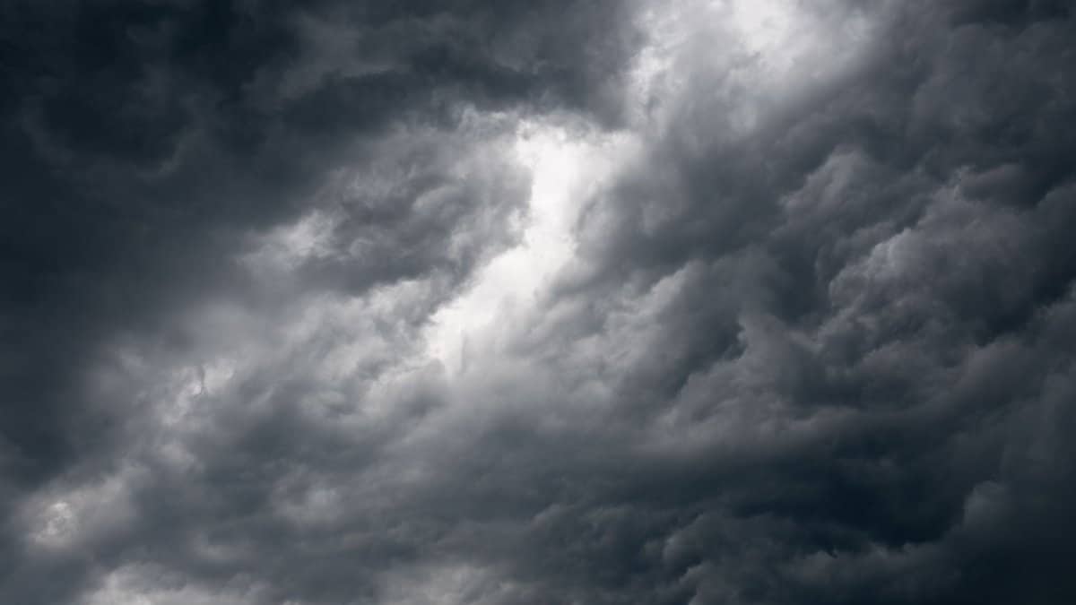 Dark storm clouds gathering over Garešnica, creating a moody and dramatic landscape scene.