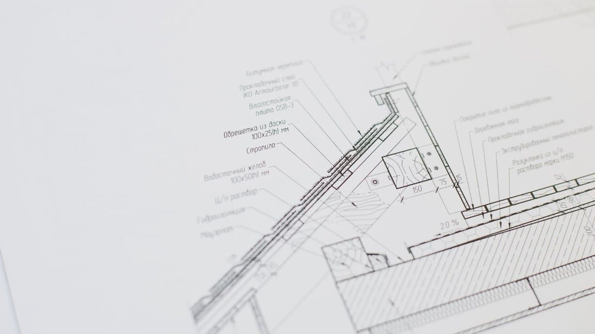 Close-up of a detailed architectural floor plan focusing on technical elements and design specifications.