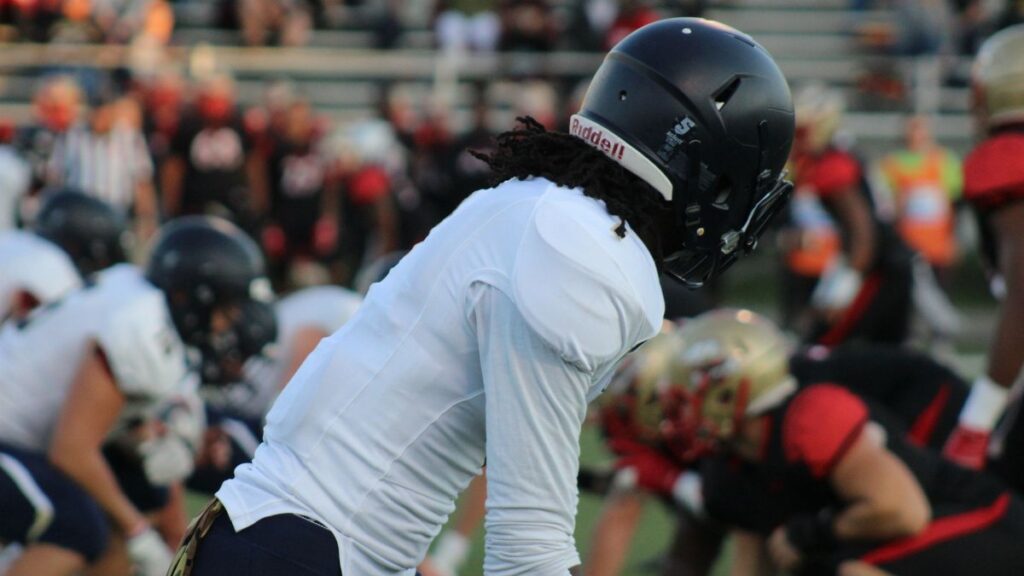 Focused shot of football players in action on a field during a game.