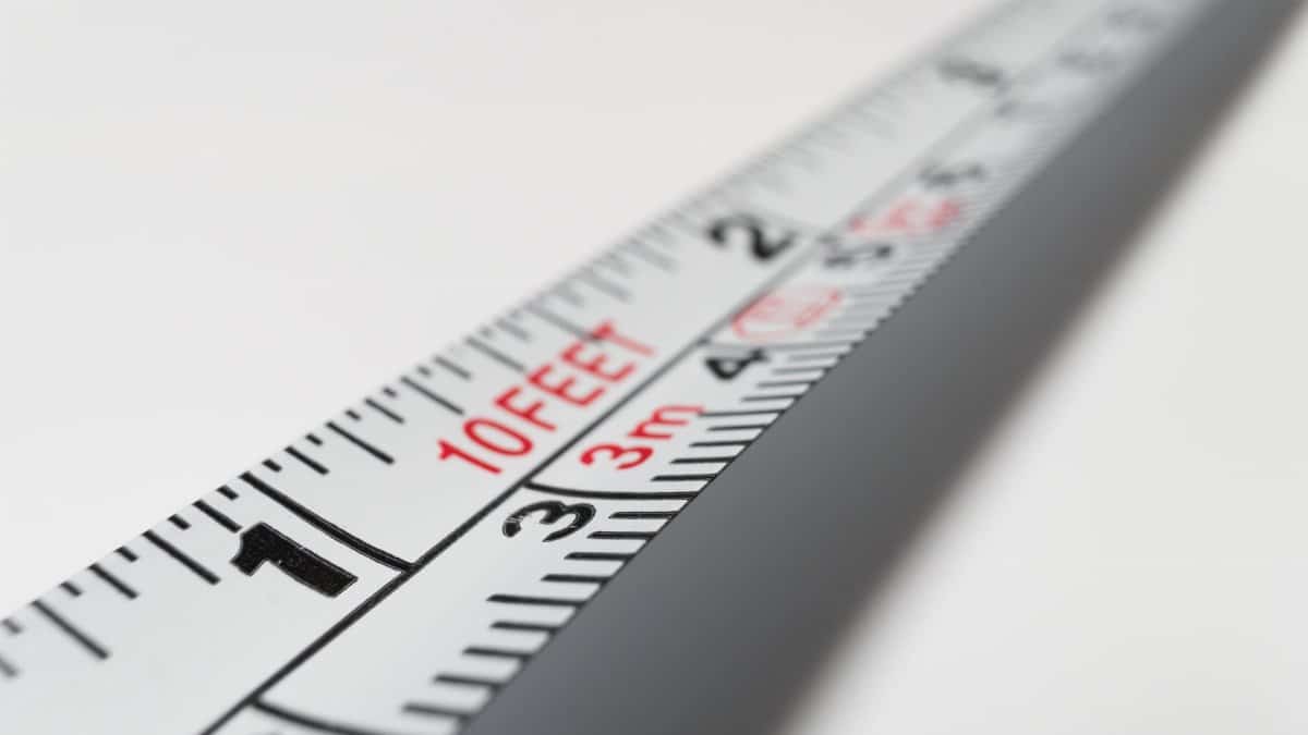 Detailed close-up of a measuring tape indicating measurements in feet and meters.